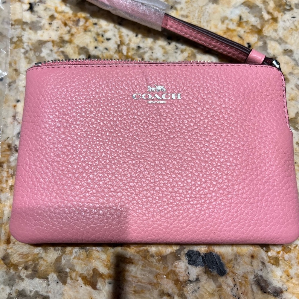 NWT. Coach Light Pink Leather Wristlet with Strap